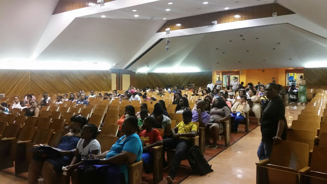 Photo of Auditorium with students and families